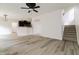 Open floor plan with modern flooring, staircase and an arched entryway to the kitchen at 616 Cheselden Dr, Durham, NC 27713