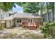 Home exterior displaying a wooden deck, gray siding, well-maintained yard, and outdoor space at 6213 Fountainhead Dr, Raleigh, NC 27609