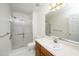 Bright bathroom featuring a shower over bath with sliding doors and a large vanity sink at 6213 Fountainhead Dr, Raleigh, NC 27609