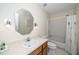 Well-lit bathroom has a single sink vanity and shower/tub combination at 6213 Fountainhead Dr, Raleigh, NC 27609
