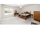 Bedroom features ceiling fan, side tables, and a wooden dresser at 6213 Fountainhead Dr, Raleigh, NC 27609