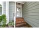 Close-up of the entryway with brick steps, showcasing the exterior design and welcoming entrance at 6213 Fountainhead Dr, Raleigh, NC 27609