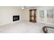 Spacious living room features a brick fireplace, ceiling fan and glass display cabinet at 6213 Fountainhead Dr, Raleigh, NC 27609