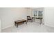 Empty living room with white walls and carpet, showcasing the potential layout with a window at 6213 Fountainhead Dr, Raleigh, NC 27609