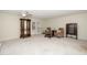 Bright living room with ceiling fan and glass display cabinet offers comfortable seating at 6213 Fountainhead Dr, Raleigh, NC 27609