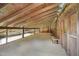 Bright barn loft interior with wooden beams and plywood flooring at 633 Fleming Rd, Youngsville, NC 27596