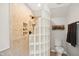 Walk-in shower with glass block wall, tile, and built-in shelving at 633 Fleming Rd, Youngsville, NC 27596