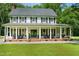 Charming two-story home with a welcoming front porch and classic architectural details at 633 Fleming Rd, Youngsville, NC 27596