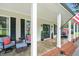 Inviting front porch featuring comfortable seating and charming decorative accents at 633 Fleming Rd, Youngsville, NC 27596