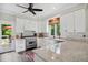 Bright kitchen features stainless steel appliances, granite counters, and white cabinets at 633 Fleming Rd, Youngsville, NC 27596