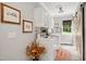 Well-lit laundry room features new machines, storage, and a sliding barn door at 633 Fleming Rd, Youngsville, NC 27596