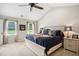 Main bedroom with a vaulted ceiling, fan, and large windows at 633 Fleming Rd, Youngsville, NC 27596