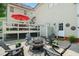 Outdoor patio with fire pit and Adirondack chairs, perfect for relaxing and entertaining guests at 633 Fleming Rd, Youngsville, NC 27596