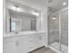 Bathroom featuring double vanity and glass shower at 6549 Tremolo Trl, Raleigh, NC 27616