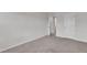Neutral bedroom with carpeted floor and white trim at 6549 Tremolo Trl, Raleigh, NC 27616