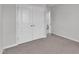 Neutral bedroom with large closet and carpeted floor at 6549 Tremolo Trl, Raleigh, NC 27616