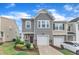 Charming two-story home with a one car garage, beautiful landscaping, and tasteful stone accents at 6549 Tremolo Trl, Raleigh, NC 27616