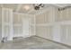 Unfinished garage with ample space and a standard entry door at 6549 Tremolo Trl, Raleigh, NC 27616