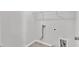 Clean laundry room with hookups and shelving at 6549 Tremolo Trl, Raleigh, NC 27616