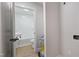 Hallway view of bathroom including new hot water heater at 658 Love Grove Church Rd, Sanford, NC 27332