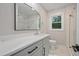 Updated bathroom featuring stylish fixtures, modern vanity, and tiled shower at 658 Love Grove Church Rd, Sanford, NC 27332