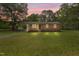Charming brick home featuring a spacious front yard, complemented by mature trees and a welcoming facade at 658 Love Grove Church Rd, Sanford, NC 27332