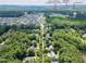 Aerial view of a tree filled neighborhood near Holly Springs Elementary School, UNC Rex Hospital and Town Hall at 709 Skymont Dr, Holly Springs, NC 27540
