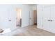 Bedroom with neutral carpet and walls, offering a calm, versatile space at 709 Skymont Dr, Holly Springs, NC 27540
