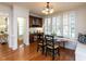 Dining area featuring a built-in bar and seating area with hardwood floors at 709 Skymont Dr, Holly Springs, NC 27540