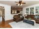 Inviting living room with plush sofas, an area rug, and large windows at 709 Skymont Dr, Holly Springs, NC 27540