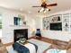 Cozy living room with a fireplace, built-in bookshelves, and comfortable seating at 709 Skymont Dr, Holly Springs, NC 27540