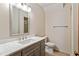 Bathroom with a marble countertop, gray vanity, and walk-in shower at 7620 Harps Mill Rd, Raleigh, NC 27615