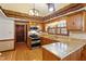 Kitchen featuring granite countertops, tile backsplash, stainless appliances, and breakfast bar at 7620 Harps Mill Rd, Raleigh, NC 27615
