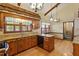 Spacious kitchen with hardwood floors, granite counters, and stainless steel appliances at 7620 Harps Mill Rd, Raleigh, NC 27615