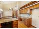 Kitchen featuring hardwood floors, granite counters, and stainless appliances at 7620 Harps Mill Rd, Raleigh, NC 27615