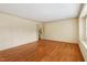 Bright living room with hardwood floors, neutral walls, and trim at 7620 Harps Mill Rd, Raleigh, NC 27615