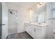 Stylish bathroom showcasing double vanity, modern fixtures, and sleek plank flooring at 80 Nailsworth St, Angier, NC 27501