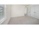 Neutral bedroom featuring plush carpet and a large window providing lots of natural light at 80 Nailsworth St, Angier, NC 27501