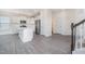 Modern kitchen featuring white cabinets, stainless steel appliances, and a center island with seating at 80 Nailsworth St, Angier, NC 27501