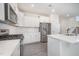 Beautiful kitchen with stainless steel appliances, white cabinets, and a center island at 80 Nailsworth St, Angier, NC 27501