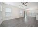 Bright living space showcasing wood-look floors, and an open layout leading to the kitchen at 80 Nailsworth St, Angier, NC 27501