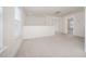 Upstairs loft area featuring neutral carpeting and natural light at 80 Nailsworth St, Angier, NC 27501