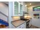 Modern kitchen with stainless steel range and white cabinets, bright and functional at 820 Runnymede Rd, Raleigh, NC 27607