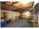 Spacious unfinished basement with carpet, storage, and room for various activities or potential renovations at 820 Runnymede Rd Rd, Raleigh, NC 27607