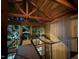 Striking interior staircase with modern railings and natural light from the large windows at 820 Runnymede Rd Rd, Raleigh, NC 27607