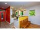 Eat-in kitchen with granite countertops, stainless appliances, with a yellow accent wall at 820 Runnymede Rd Rd, Raleigh, NC 27607