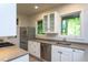 Bright kitchen with stainless steel appliances, white cabinetry, and natural light at 820 Runnymede Rd Rd, Raleigh, NC 27607