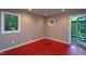 Cozy bonus room with a unique round window and access to the outdoors at 820 Runnymede Rd Rd, Raleigh, NC 27607