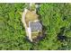 Stunning aerial view of a house surrounded by lush greenery with a well-manicured lawn at 88 Priscilla Ln, Fuquay Varina, NC 27526