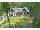 Picturesque two-story house framed by lush greenery, showcasing a beautifully landscaped front yard and inviting entrance at 88 Priscilla Ln, Fuquay Varina, NC 27526